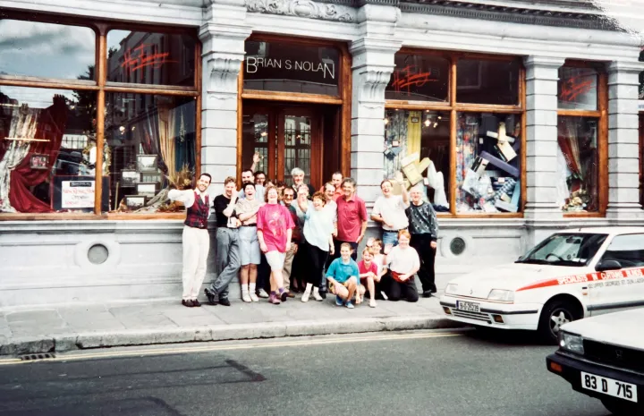 Brian S Nolan family in front of shop